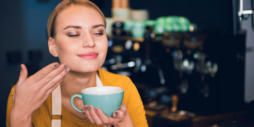 coffee: woman smelling the scent of coffee